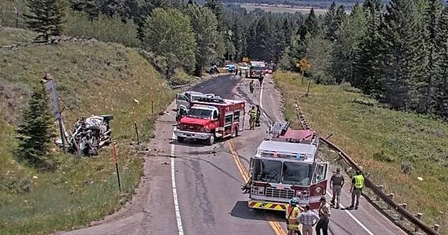 Emergency crews respond to a crash with an overturned dump truck on Teton Pass