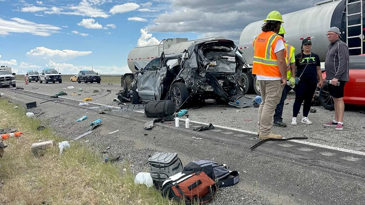 Emergency crews and bystanders respond to a multi-vehicle crash on a Wyoming highway