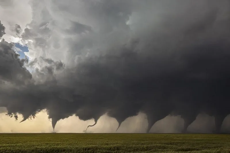 Storm clouds building over a field during a severe weather outbreak forecast