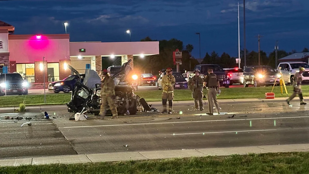 Damaged vehicles and emergency crews at a deadly crash scene outside a Walmart in Riverton, Wyoming